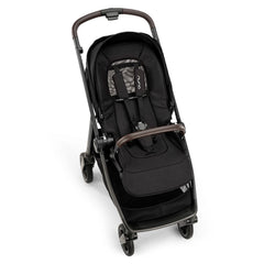 Coche Nuna Swiv Caviar Reversible